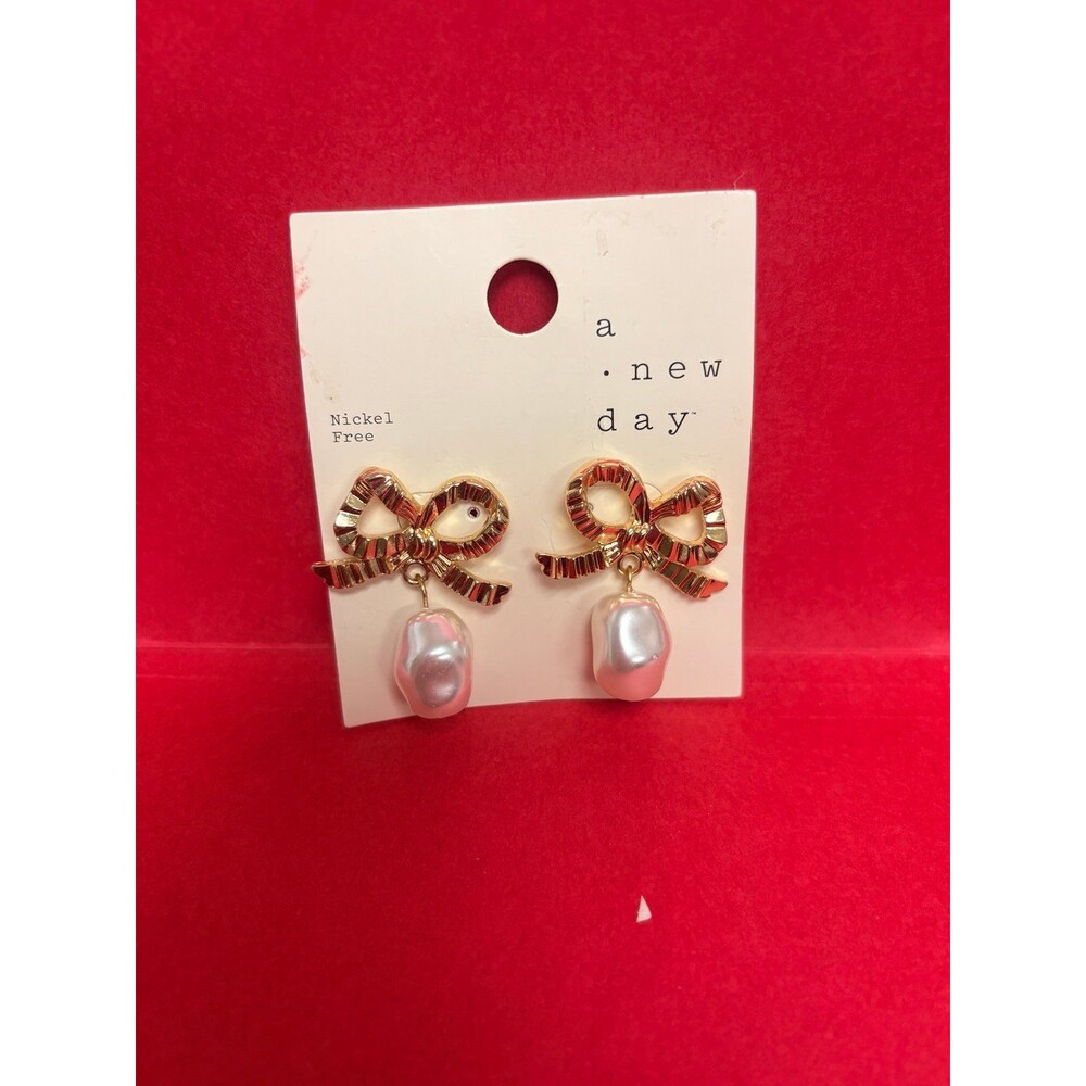 Earrings Bow earrings with‎ dangling teardrop faux pearl NWT